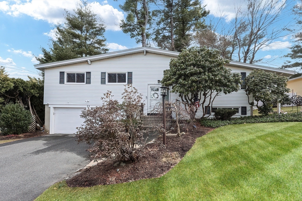 33 Debra Lane Framingham, MA 01701 - Photo 1 of 40 a view of a house with backyard and garden