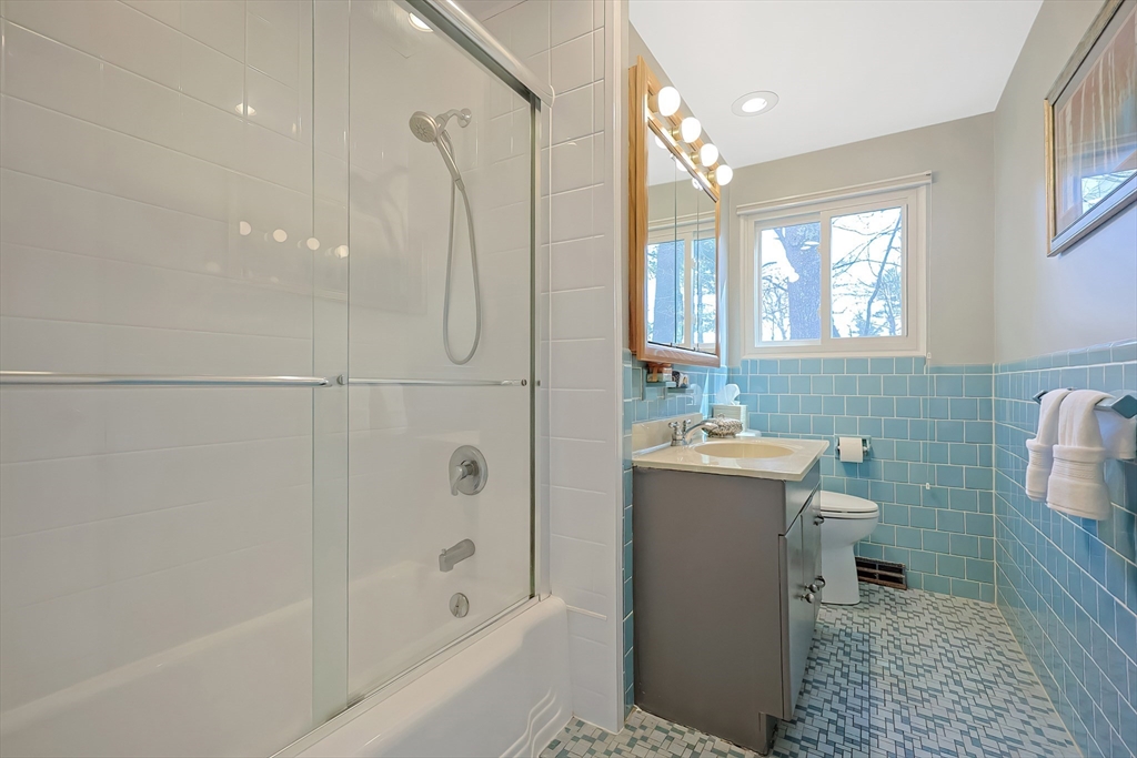 33 Debra Lane Framingham, MA 01701 - Photo 23 of 40 a bathroom with a sink a toilet and shower