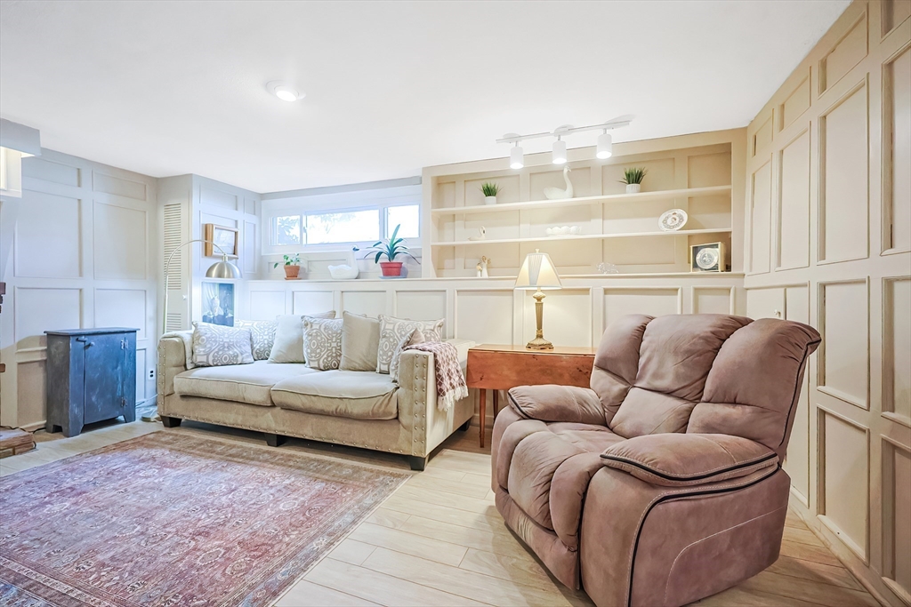 33 Debra Lane Framingham, MA 01701 - Photo 25 of 40 a living room with furniture and a large window