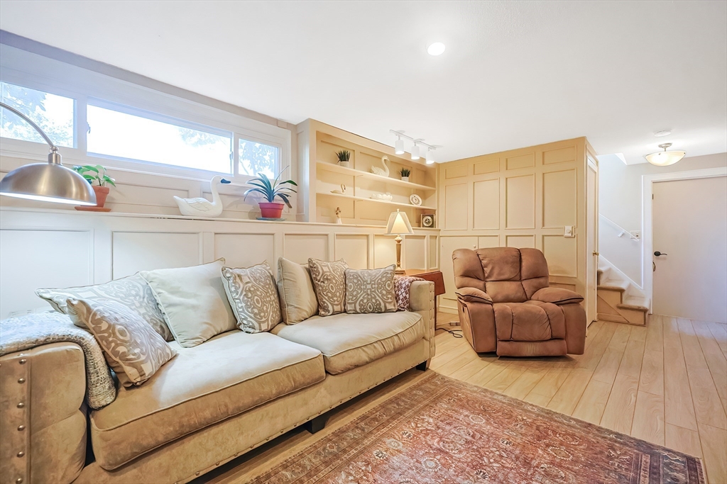 33 Debra Lane Framingham, MA 01701 - Photo 26 of 40 a living room with furniture and a large window