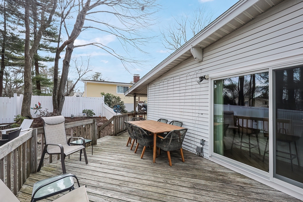 33 Debra Lane Framingham, MA 01701 - Photo 35 of 40 a view of a dinning table and chairs in patio of the house