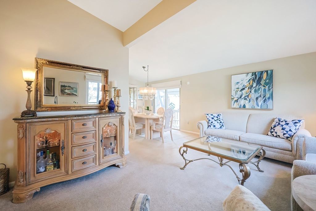 33 Debra Lane Framingham, MA 01701 - Photo 5 of 40 a living room with furniture a couch and kitchen view
