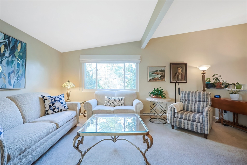 33 Debra Lane Framingham, MA 01701 - Photo 6 of 40 a living room with furniture and a large window