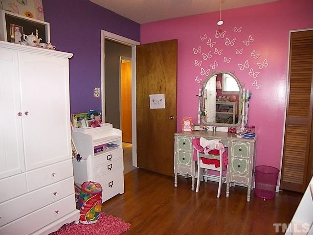 1502 Kennon Road Garner, NC 27529 - Photo 13 of 25 Secondary bedroom could also be used as an office or playroom, and has nice closet and storage space.