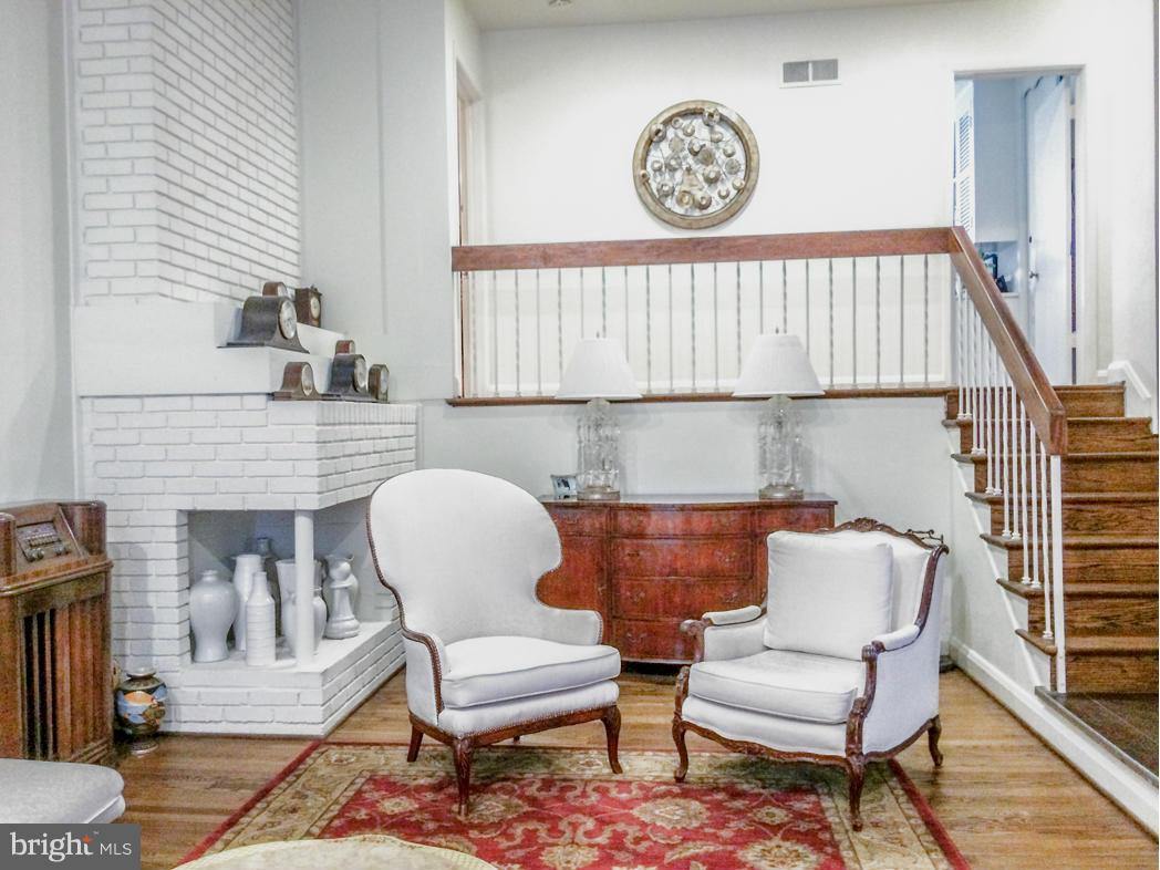7512 Labyrinth Road Pikesville, MD 21208 - Photo 2 of 24 a view of a chairs and a table in a chair