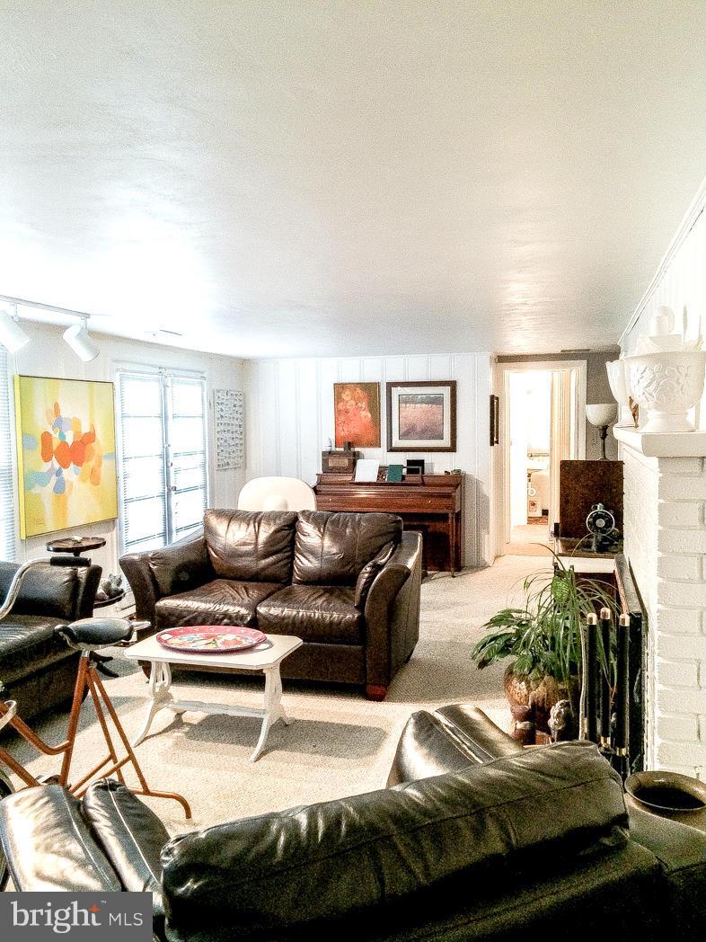 7512 Labyrinth Road Pikesville, MD 21208 - Photo 23 of 24 a living room with furniture and a flat screen tv