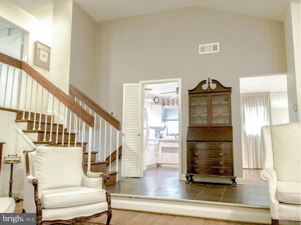 7512 Labyrinth Road Pikesville, MD 21208 - Photo 7 of 24 a view of staircase with white walls and railing