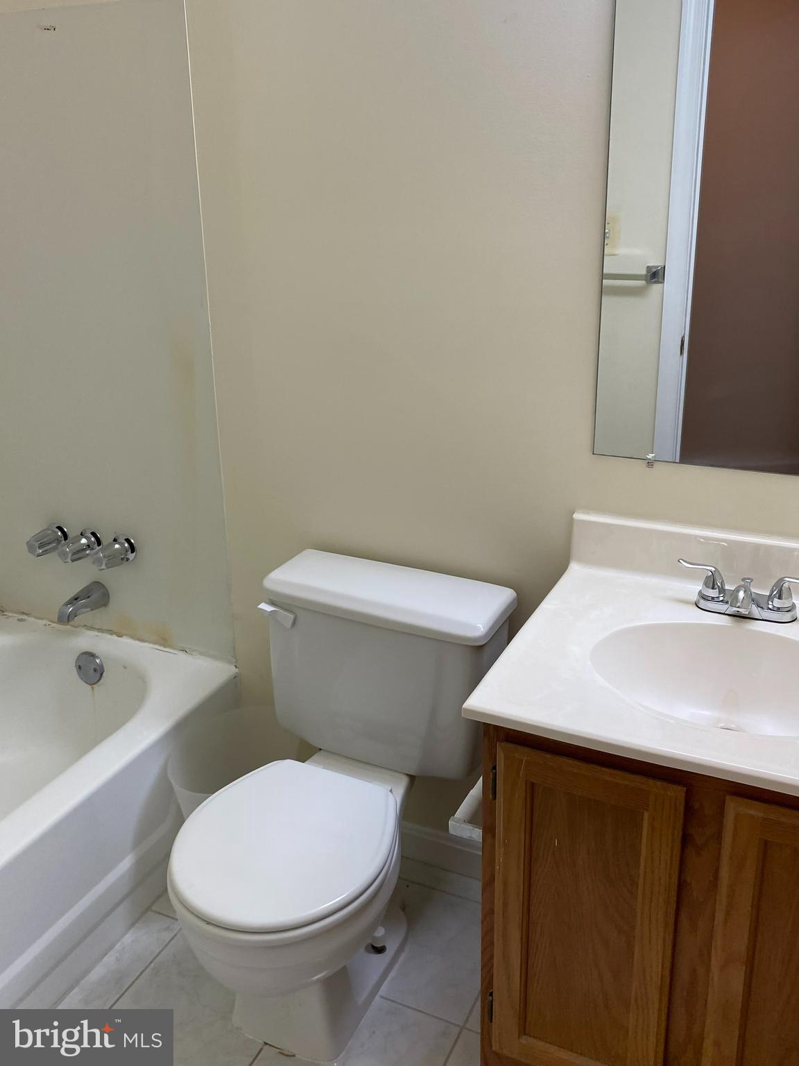 9006 Pickwick Village Terrace Silver Spring, MD 20901 - Photo 11 of 13 a white toilet sitting next to a bathroom sink