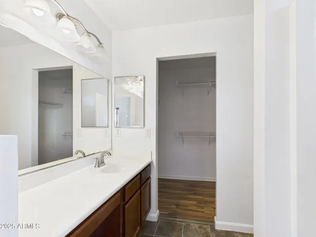 a bathroom with a sink double vanity and a mirror