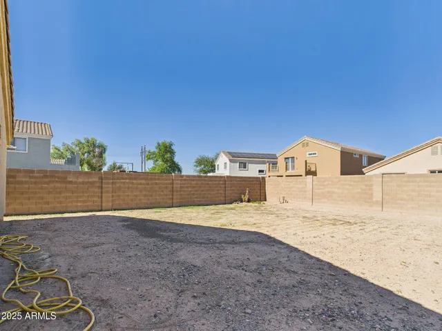 a view of a backyard of the house