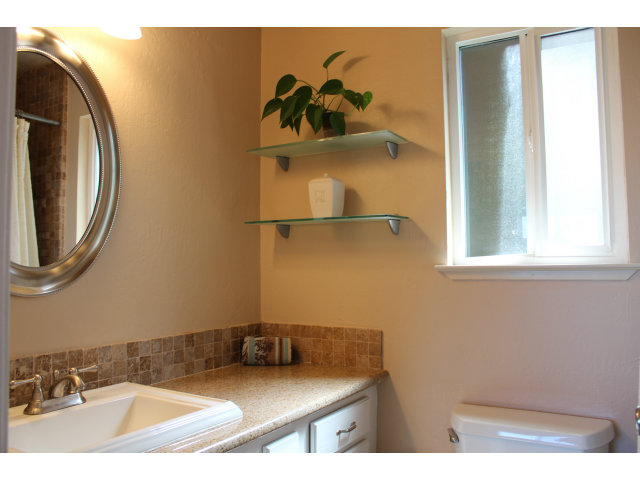 508 Monterey Road, Unit E Pacifica, CA 94044 - Photo 11 of 17 a bathroom with a sink and a mirror