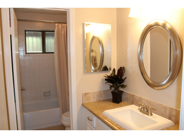 508 Monterey Road, Unit E Pacifica, CA 94044 - Photo 12 of 17 a bathroom with a sink and a mirror