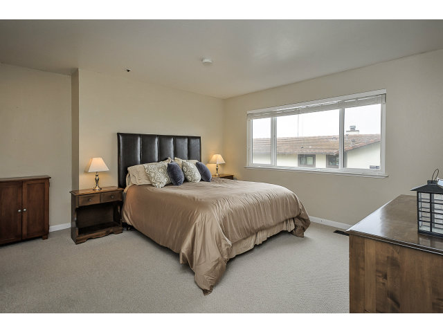 508 Monterey Road, Unit E Pacifica, CA 94044 - Photo 16 of 17 a spacious bedroom with a bed and window