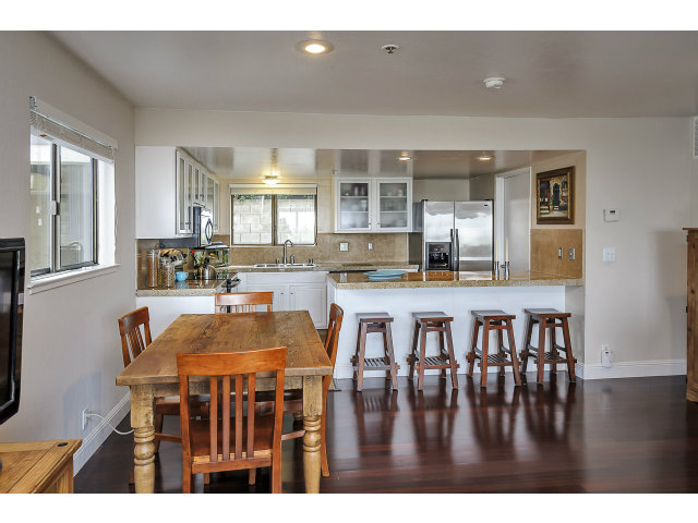 508 Monterey Road, Unit E Pacifica, CA 94044 - Photo 5 of 17 a kitchen with a table and chairs
