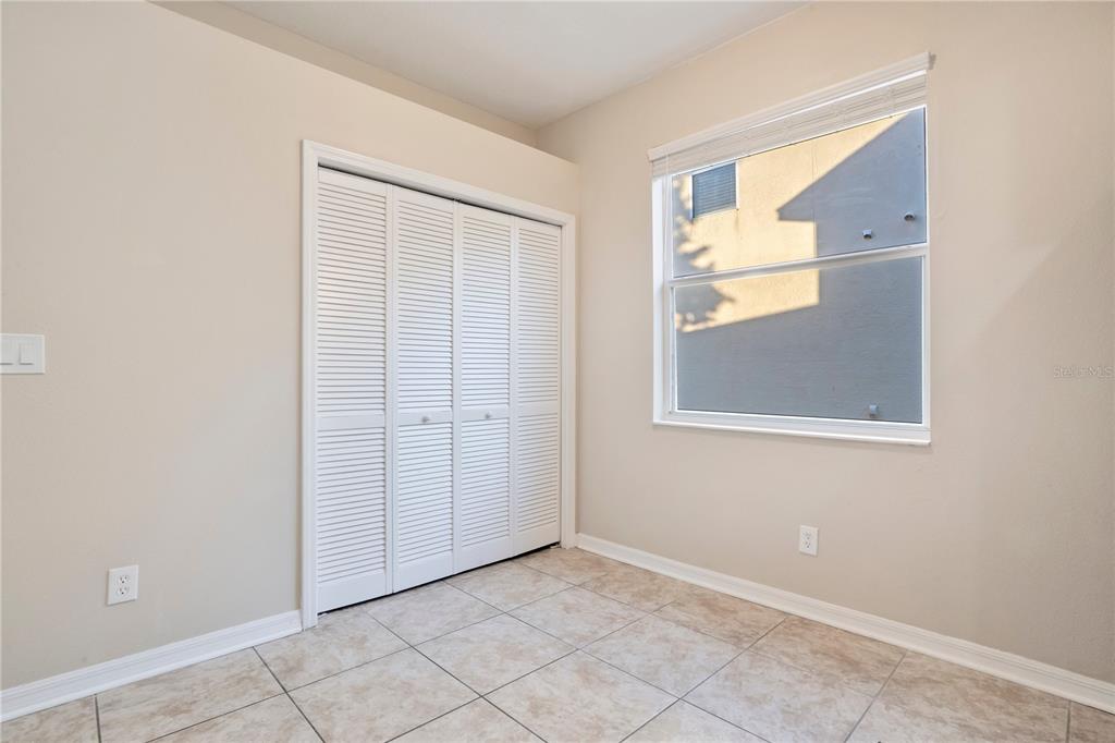 15031 Skip Jack Loop Lakewood Ranch, FL 34202 - Photo 12 of 27 a view of an empty room with window and closet area