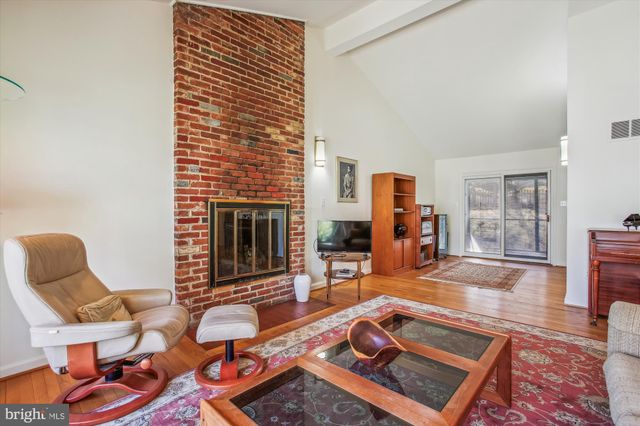 a room with furniture and a fireplace