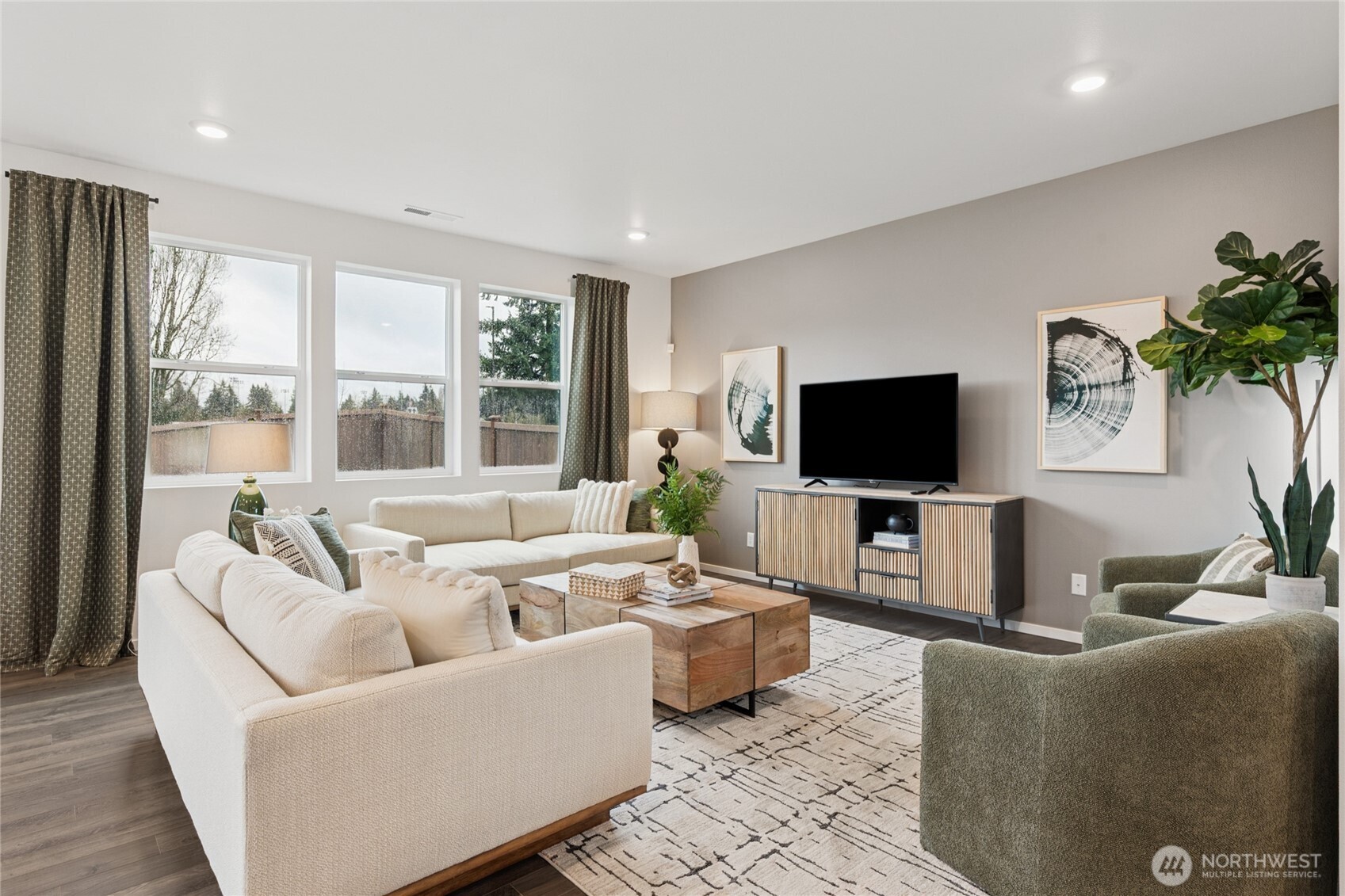 541 Hann Street, Unit 6 Buckley, WA 98321 - Photo 2 of 36 a living room with furniture and a flat screen tv
