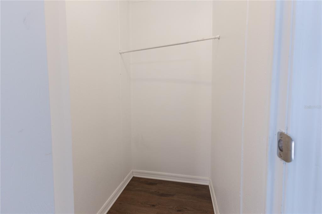 4872 Evans Street Coleman, FL 33521 - Photo 12 of 24 a view of a room with racks on the wall