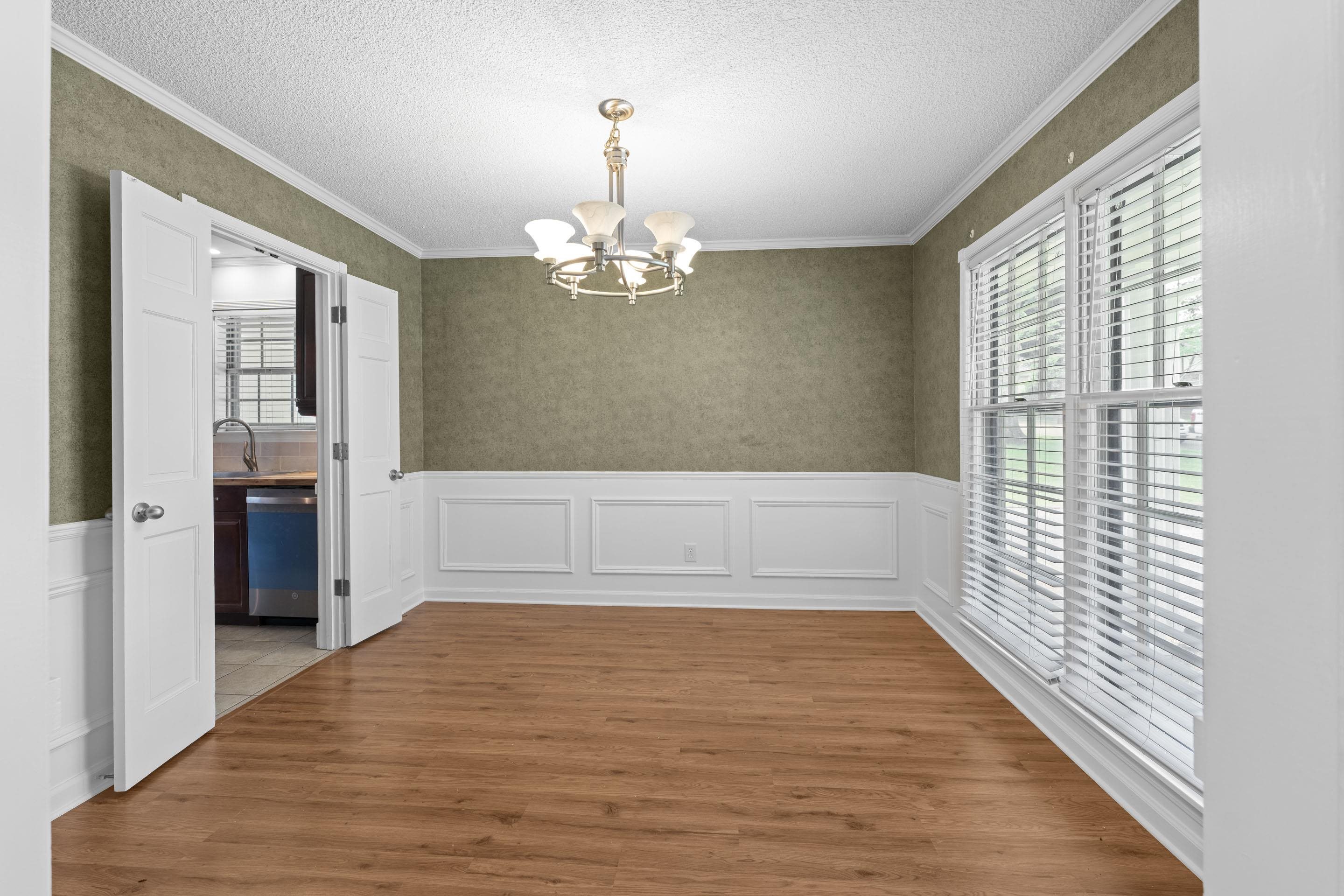 499 Duscoe Street Collierville, TN 38017 - Photo 14 of 38 wooden floor in an empty room with a window