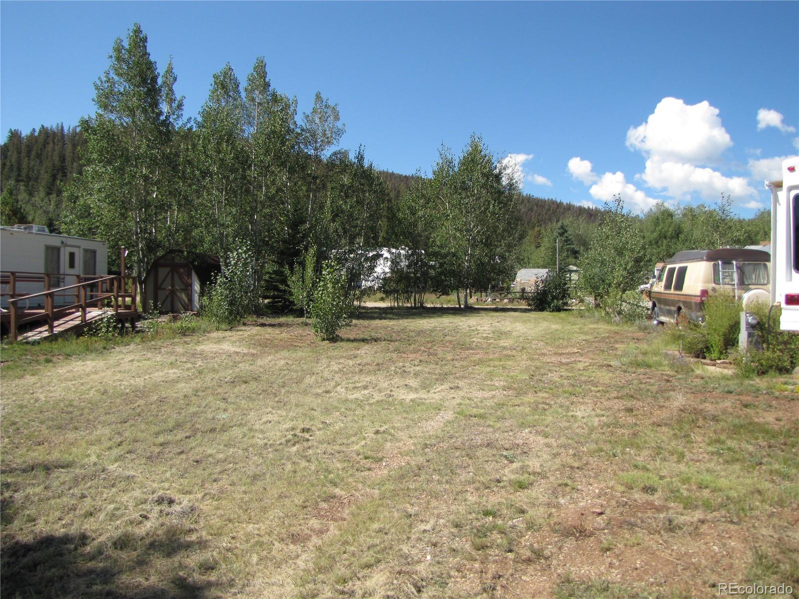 a view of outdoor space with playground and green space