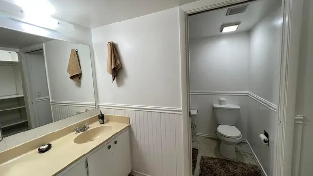 a bathroom with a sink and mirror