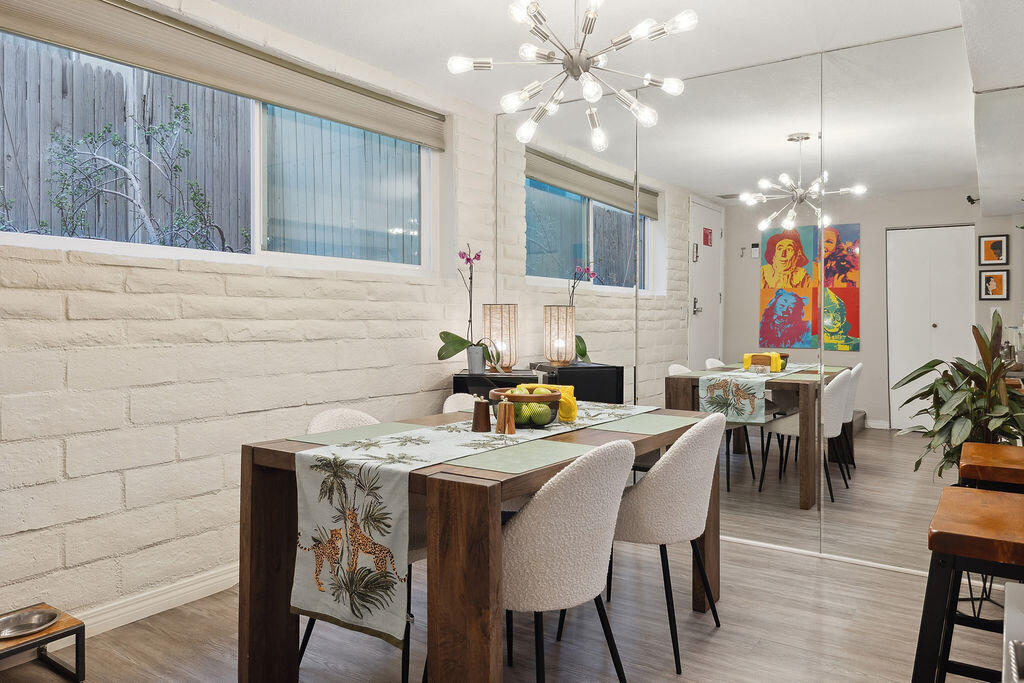 11625 Texas Avenue, Unit 101 Los Angeles, CA 90025 - Photo 11 of 40 a view of a dining room with furniture and chandelier