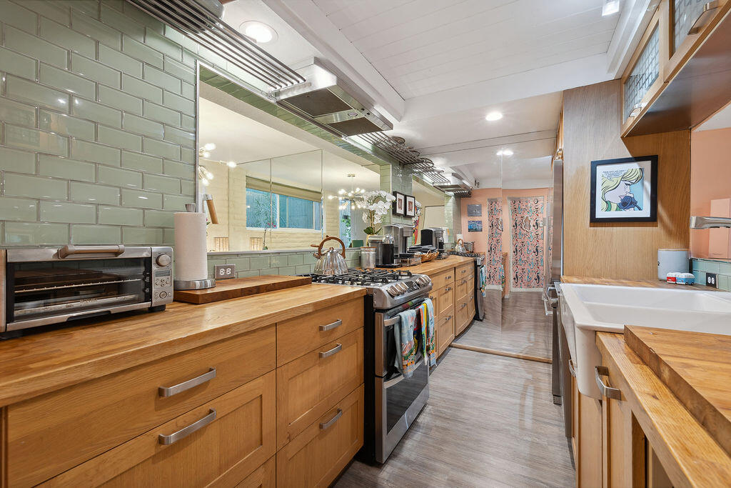 11625 Texas Avenue, Unit 101 Los Angeles, CA 90025 - Photo 14 of 40 a large kitchen with stainless steel appliances and large counter space