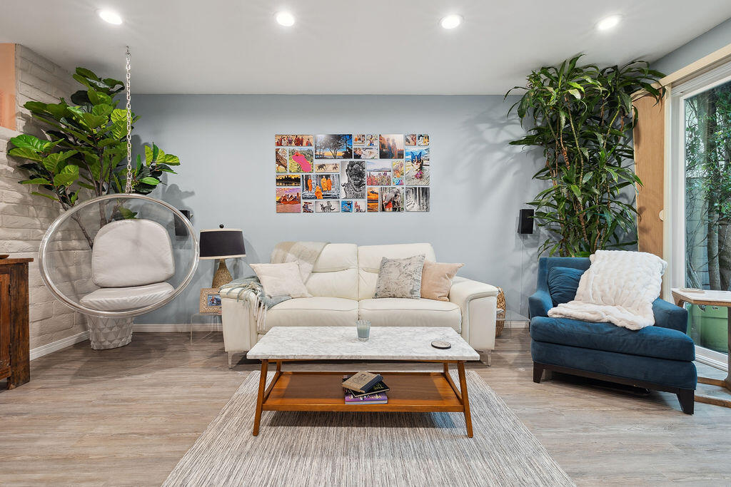 11625 Texas Avenue, Unit 101 Los Angeles, CA 90025 - Photo 2 of 40 a living room with furniture a potted plant and a table