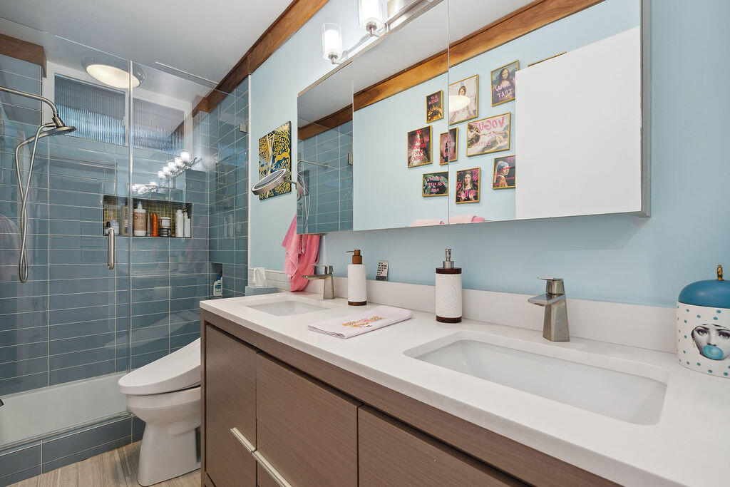 11625 Texas Avenue, Unit 101 Los Angeles, CA 90025 - Photo 23 of 40 a bathroom with a sink a toilet and shower
