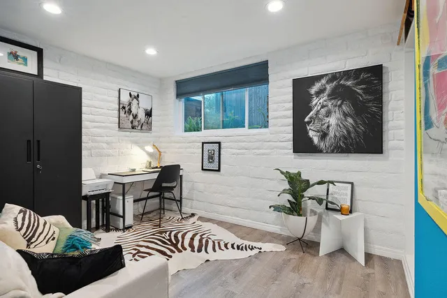 a bedroom with a bed and a chair