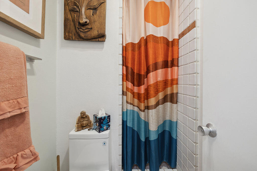 11625 Texas Avenue, Unit 101 Los Angeles, CA 90025 - Photo 31 of 40 a bathroom with a sink and mirror with window