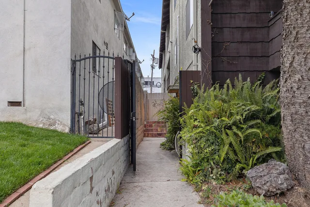 a backyard of a building with lots of trees