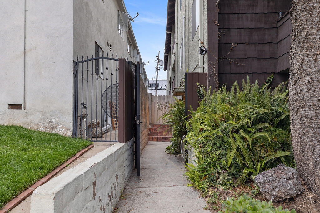 11625 Texas Avenue, Unit 101 Los Angeles, CA 90025 - Photo 36 of 40 a view of an entrance to house with yard and green space