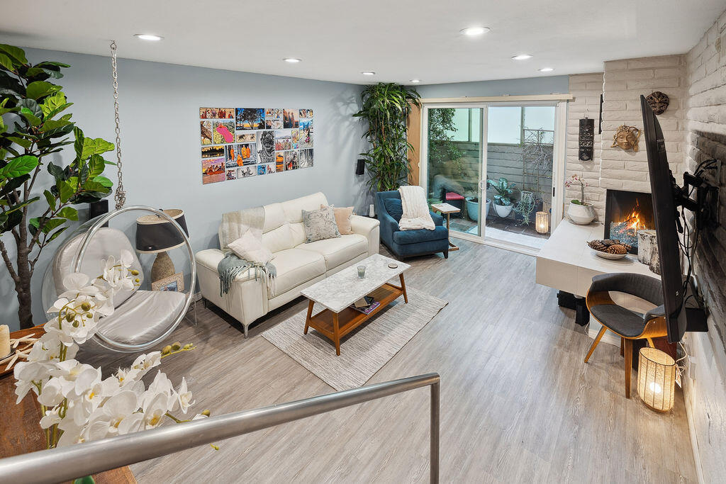 11625 Texas Avenue, Unit 101 Los Angeles, CA 90025 - Photo 5 of 40 a living room with furniture and a flat screen tv