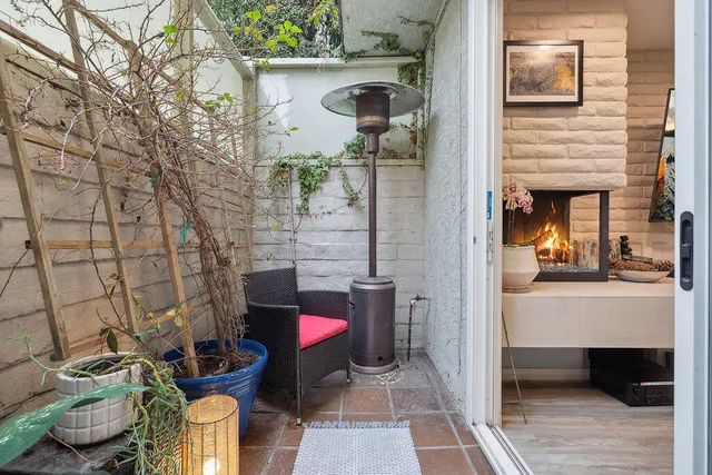 a bathroom with a toilet and shower