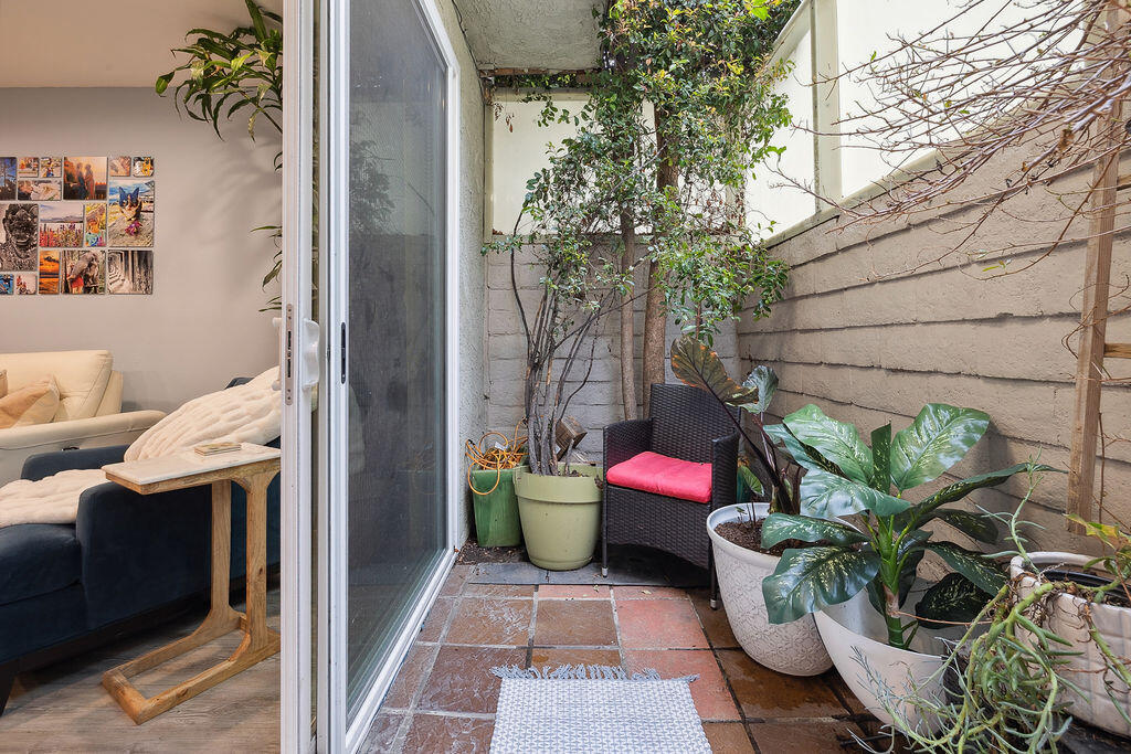 11625 Texas Avenue, Unit 101 Los Angeles, CA 90025 - Photo 8 of 40 a house with lots of potted plants