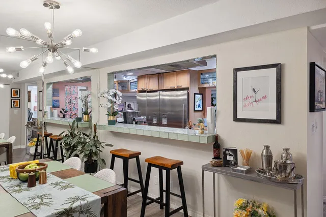 a kitchen with a table and chairs in it