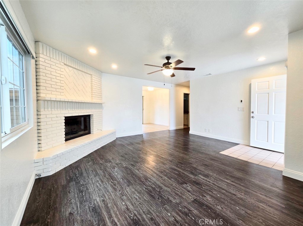 7352 Nada Street Downey, CA 90242 - Photo 11 of 28 a view of an empty room with a fireplace and a window