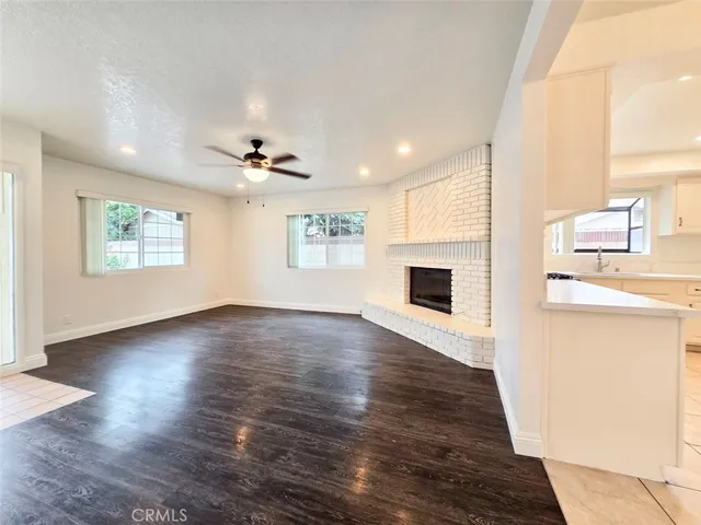 a view of livingroom with hardwood floor and a ceiling fan