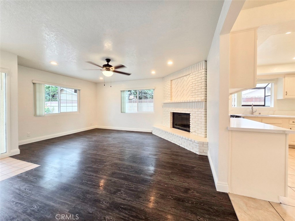 7352 Nada Street Downey, CA 90242 - Photo 12 of 28 a view of livingroom with hardwood floor and a ceiling fan
