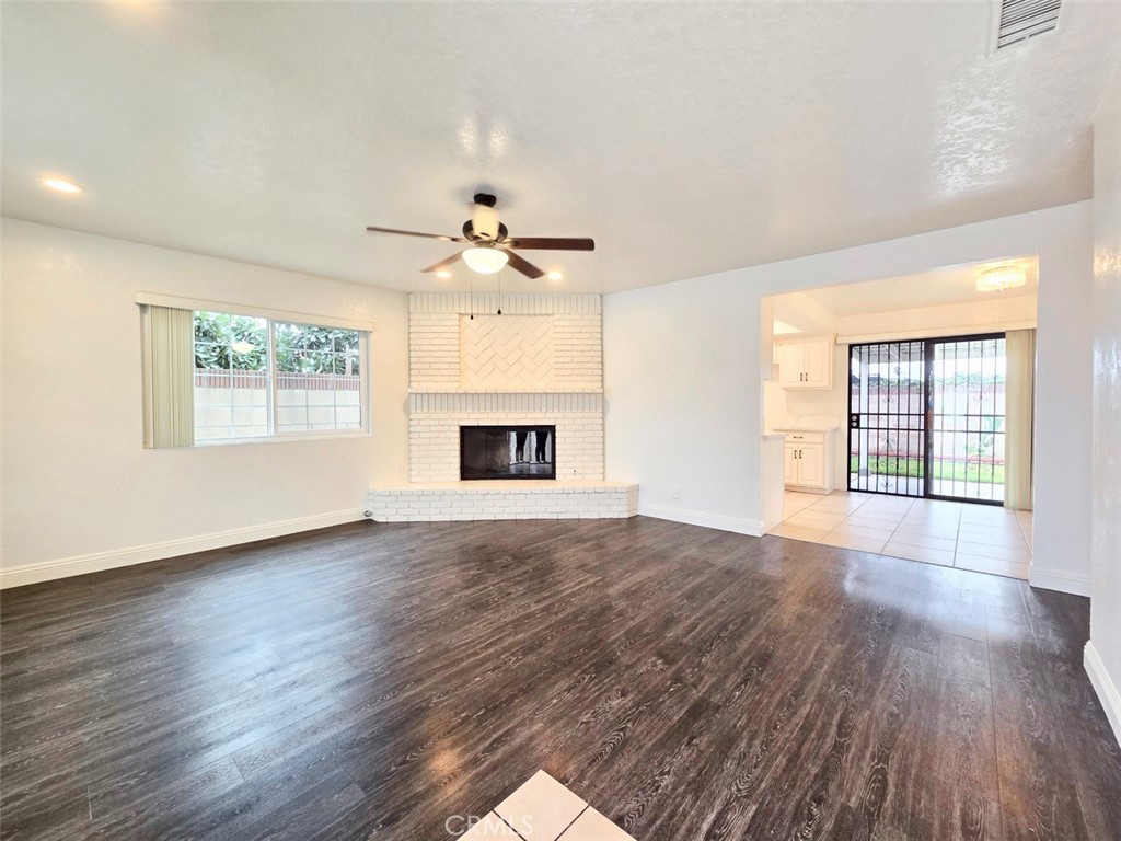 7352 Nada Street Downey, CA 90242 - Photo 14 of 28 a view of an empty room with wooden floor and a window