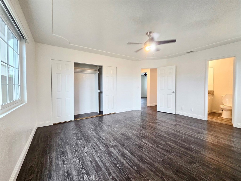 7352 Nada Street Downey, CA 90242 - Photo 16 of 28 a view of an empty room with wooden floor and a window