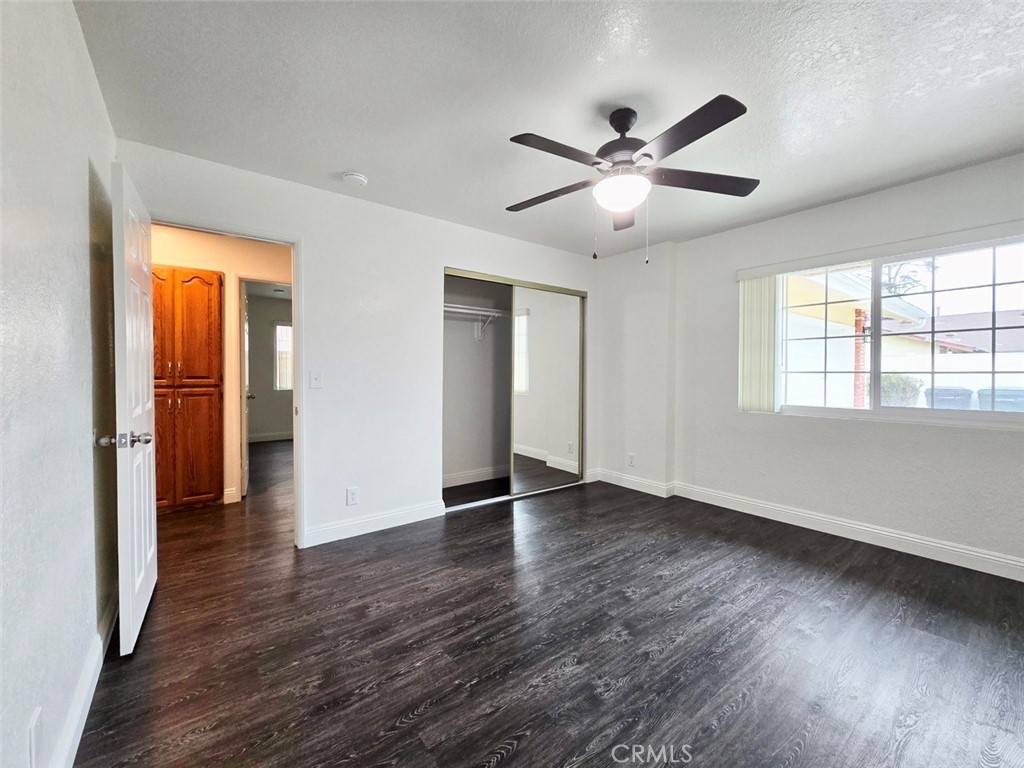 7352 Nada Street Downey, CA 90242 - Photo 18 of 28 a view of an empty room with wooden floor and a window