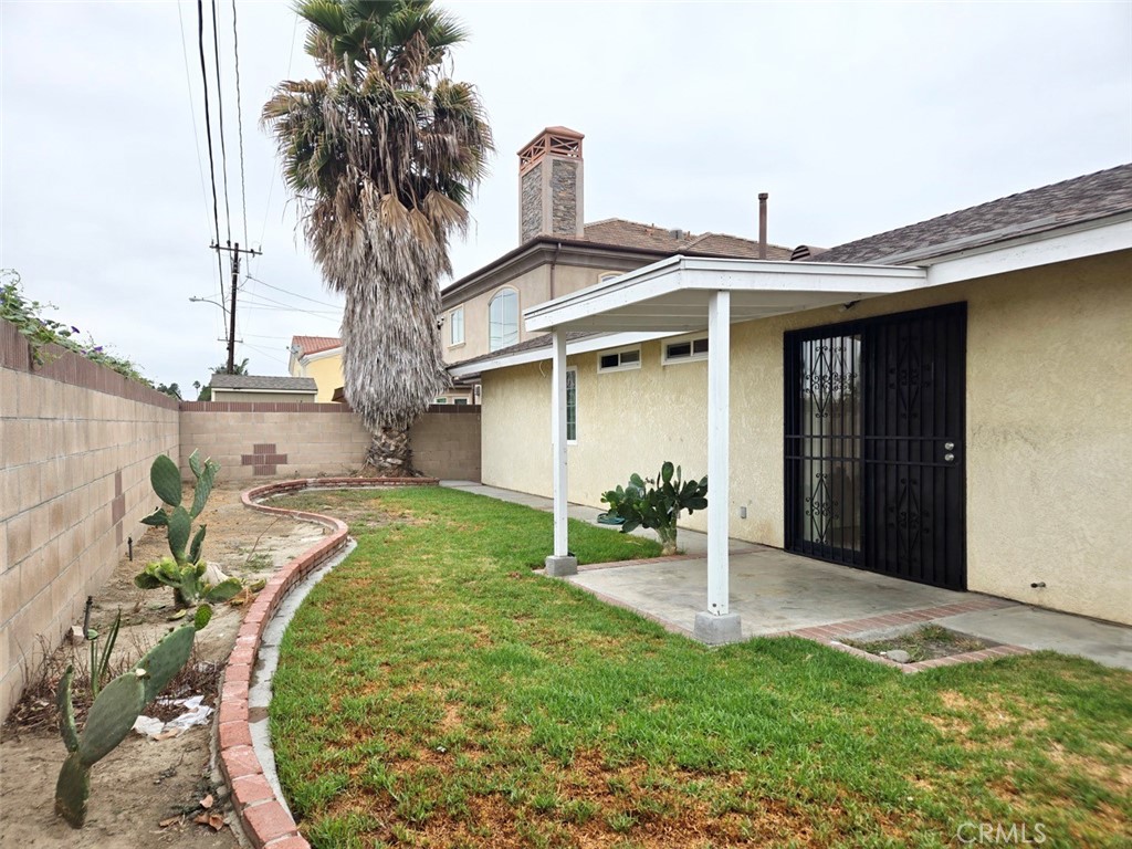 7352 Nada Street Downey, CA 90242 - Photo 22 of 28 a front view of a house with garden