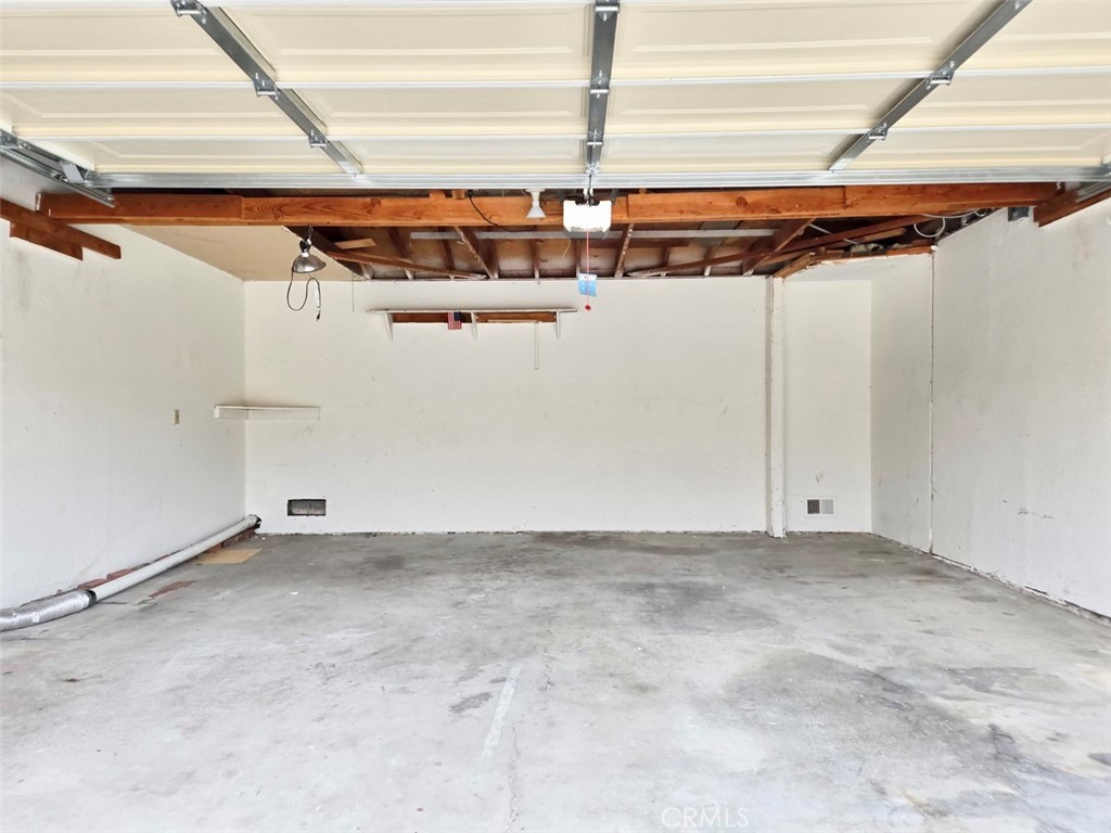 7352 Nada Street Downey, CA 90242 - Photo 27 of 28 a view of a room with racks on the wall
