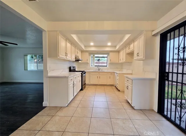 a kitchen with a cabinets and window
