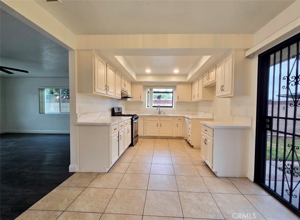 7352 Nada Street Downey, CA 90242 - Photo 9 of 28 a kitchen with a cabinets and window