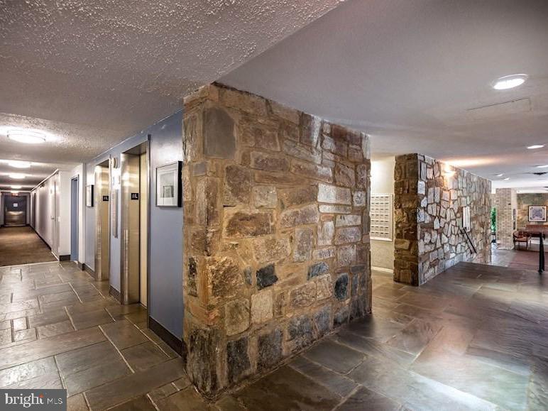 3245 Rio Drive, Unit 604 Falls Church, VA 22041 - Photo 15 of 20 Charming stone-clad corridor awaits.