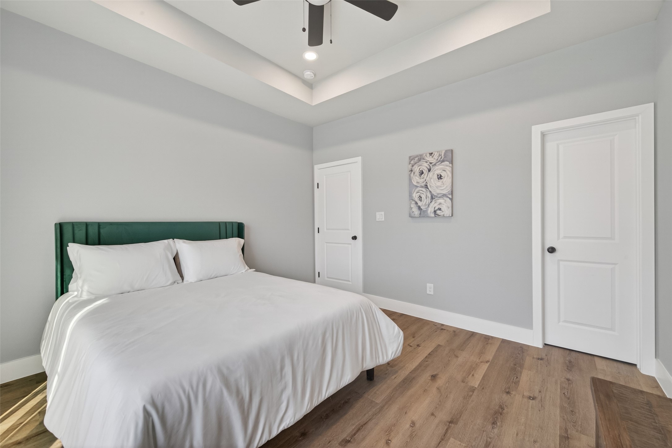 4117 Yale Street Houston, TX 77018 - Photo 34 of 37 a large bed sitting in a bedroom and a chandelier