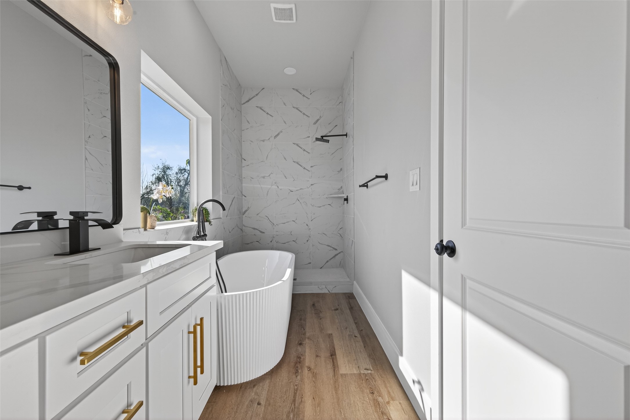 4117 Yale Street Houston, TX 77018 - Photo 37 of 37 a bathroom with a sink a toilet and a large mirror